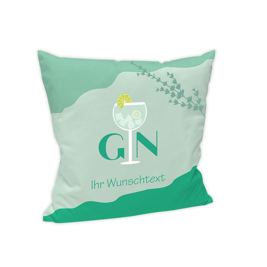 Der Hintergrund des Kissens ist in einem Pastell-Mint Farbton dargestellt.
Im unteren Bereich ist der Mint Farbton dunkler dargestellt. Im oberen Bereich ist das Mint in einem mittleren Farbton abgesetzt. Dort befinden sich ein Kräuterzweig in Mint.
In der Mitte steht das Wort "Gin", wobei das "i" durch ein Cocktailglas ersetzt wurde.
Unter "Gin" steht noch "Ihr Wunschtext".