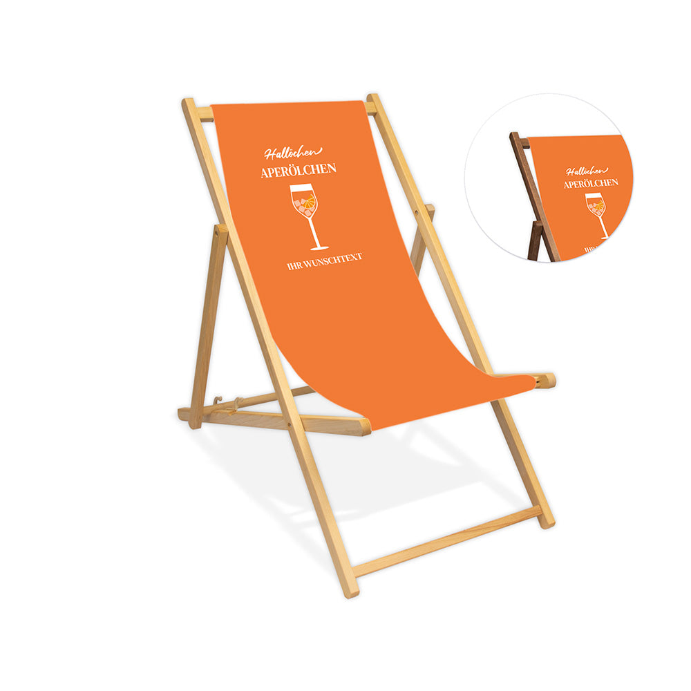 Mittig ist ein farbloser Holzliegestuhl ohne Armlehne abgebildet.
Orangenes Motiv mit dem Spruch "Hallöchen Aperölchen". 
Neben dem Liegestuhl ist in einem Kreis die Lasurfarbe dunkelbraun abgebildet.