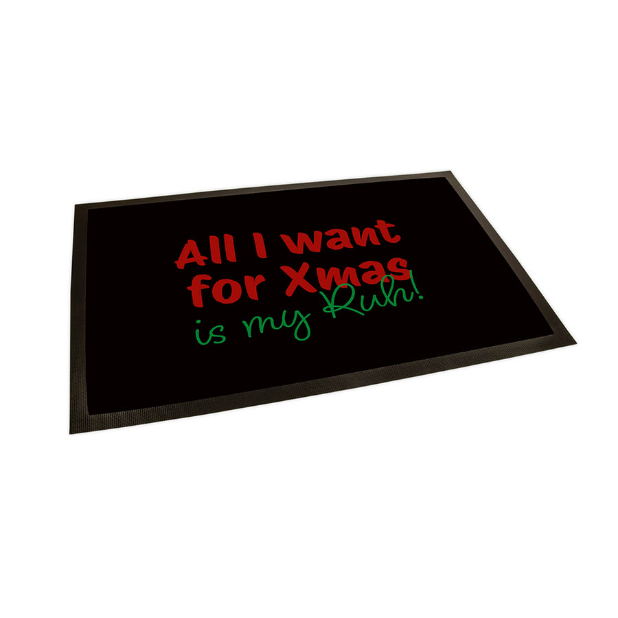 Der Hintergrund der Fußmatte ist in schwarz gehalten. Als Text steht in Rot "All I want for Xmas" und darunter in einer geschriebenen Schriftart in grün "is my Ruh!"